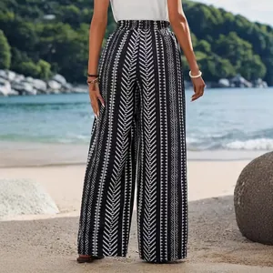 Pantaloni a gamba larga da donna con stampa geometrica e vita elastica in spiaggia