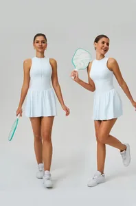 Model wearing a light blue tennis dress with stand collar and pleated A-line skirt