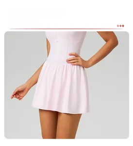 Close-up detail of a pink A-line tennis dress with high-waist athletic design