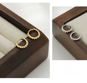 Detailed view of S925 sterling silver beaded hoop earrings in gold and silver finish