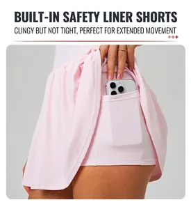 Detailed view of pink tennis dress featuring built-in shorts and a functional phone pocket