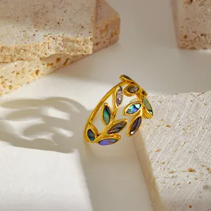 Exquisite close-up detail of a retro enamel leaf open ring with colorful shell inlay