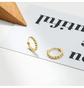 Detailed view of French vintage S925 silver beaded hoop earrings with gold finish.