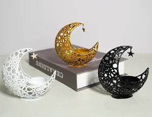 Decorative hollow metal crescent moon candle holders in elegant white, gold, and black finishes