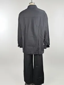 Back view of women's loose charcoal grey shirt and wide-leg trousers lounge set