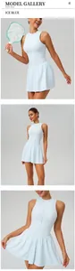Detail views of a light blue sleeveless tennis dress with a stand collar.
