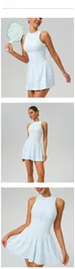 Detail views of a light blue sleeveless tennis dress with a stand collar.