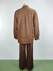 Back view of women's casual brown two-piece set with loose long sleeve shirt and trousers