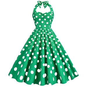 Abito vintage verde con scollo all'americana e grandi pois bianchi stile swing retrò