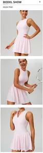 Close-up detail showing the stand collar and pink fabric of the mock two-piece tennis dress.