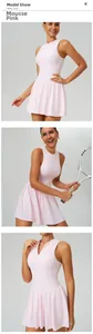Close-up detail showing the stand collar and pink fabric of the mock two-piece tennis dress.