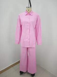 Women's pink long-sleeve casual shirt and wide-leg trousers set shown on a mannequin