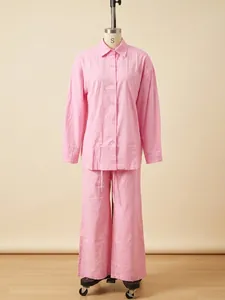 Women's pink long-sleeve casual shirt and wide-leg trousers set shown on a mannequin