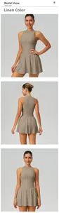 Front and back detail views of a sleeveless A-line athletic tennis dress in linen color.