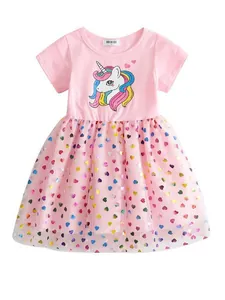 Pink girls dress featuring colorful unicorn print and heart-patterned tulle skirt.