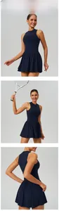 Detailed close-up of navy blue tennis dress featuring a pleated skirt and zipper collar