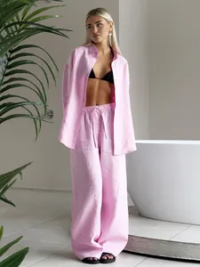 Stylish pink linen-style long-sleeve shirt and wide-leg trousers two-piece set for women.