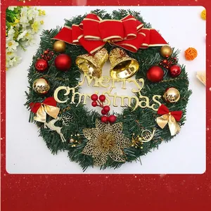 Detailed view of a lush Christmas wreath with red bows and gold bells