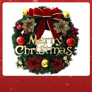 Close-up detail of a festive green Christmas wreath with large red bow and gold ornaments