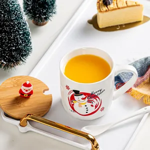 Christmas snowman ceramic mug with wooden lid and Santa figurine in festive setting