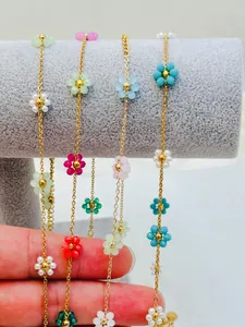 Detailed view of colorful handmade beaded flower gold chains for DIY jewelry making