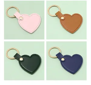 Collection of heart-shaped leather keychains in pink, brown, green, and blue colors