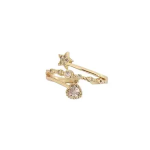 Elegant gold wrap ring featuring sparkling heart and star charms on white background