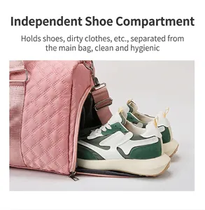 Detail view showing the independent side shoe compartment of a quilted pink travel gym bag