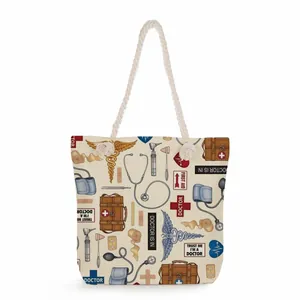 Detail shot of a canvas tote bag featuring a medical-themed print and rope handles.