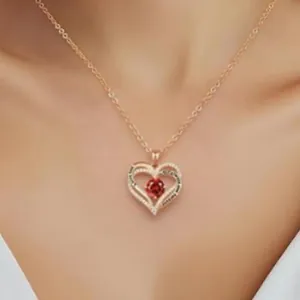 Elegant rose gold double heart pendant necklace with red birthstone on a model's neck
