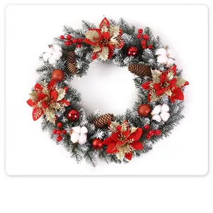Frosted Christmas wreath with red poinsettias, pine cones, and berries for door decor.