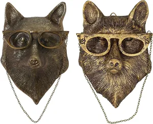 Close-up of vintage imitation bronze animal wall hangings with creative glasses details