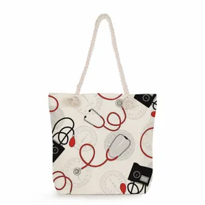 Close-up of high-capacity canvas tote bag with red stethoscope and medical prints