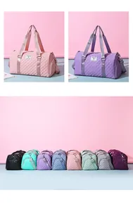 Large capacity quilted travel duffel bags in various colors for sports and fitness use