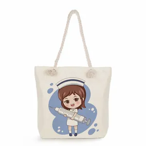 Detailed view of canvas tote bag featuring a cute nurse character cartoon print.