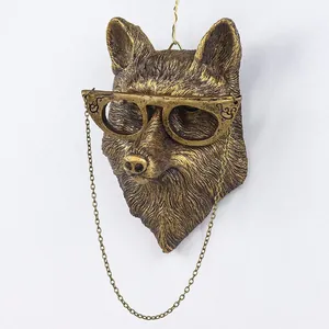 Decorative antique bronze wolf head wall hanging sculpture featuring vintage glasses and chain