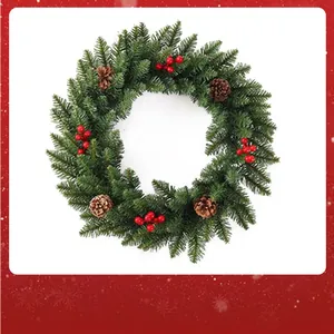 Detailed view of a Christmas wreath with pine needles, red berries and pinecones