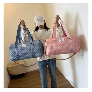 Large quilted travel duffel bag for gym and short trips in blue and pink colors