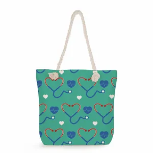 Detail of nurse themed canvas tote bag with heart stethoscope pattern and rope handles