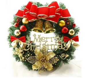 Detailed view of a festive Christmas wreath with red bow and Merry Christmas sign