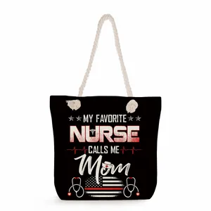 Large black canvas tote bag featuring My Favorite Nurse Calls Me Mom graphic design print