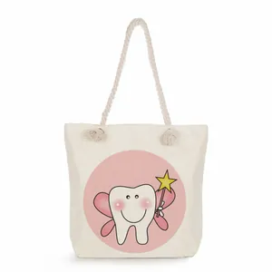 Detailed view of a cute tooth fairy print on a large capacity white canvas tote shopping bag