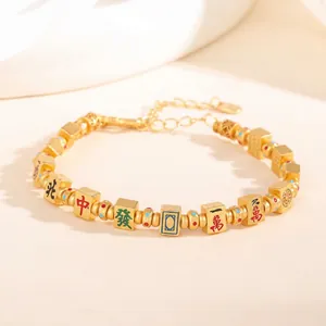 Exquisite gold-plated Mahjong charm bracelet featuring traditional Chinese tile designs