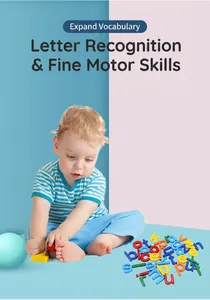 Toddler playing with colorful educational plastic alphabet magnets on a soft mat