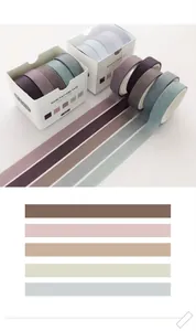 Detailed view of ocher washi tape set with five rolls and color sample strips