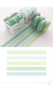 Macro detail of a 5-roll green washi tape set including its color swatch palette