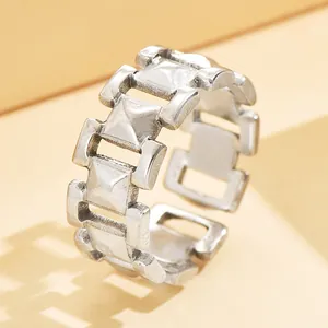 Detailed macro view of silver chunky chain link interlocking minimalist metal ring