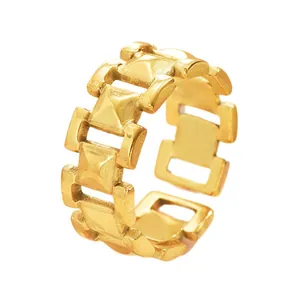 Close-up of a gold chain link ring featuring a unique industrial interconnected design style.