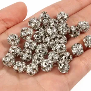 Silver-plated hollow rhinestone ball spacer beads for DIY jewelry making on hand
