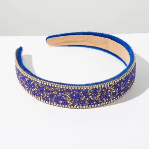 Detailed macro shot of vintage Baroque headband featuring blue beads and gold rhinestones